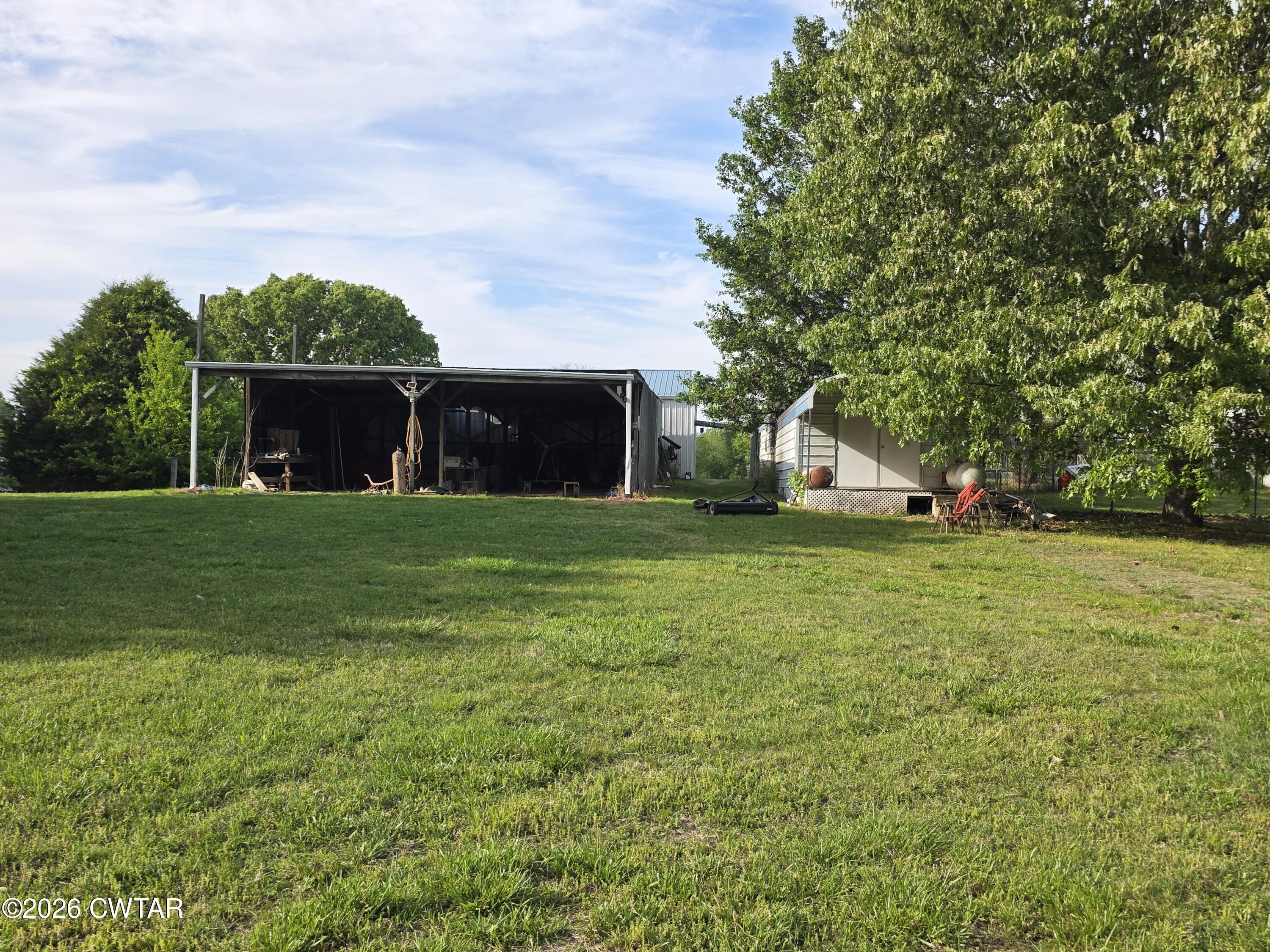 111 Leighton County Line Road Denmark, TN 38391 - Photo 16 of 53 a view of a house with a yard