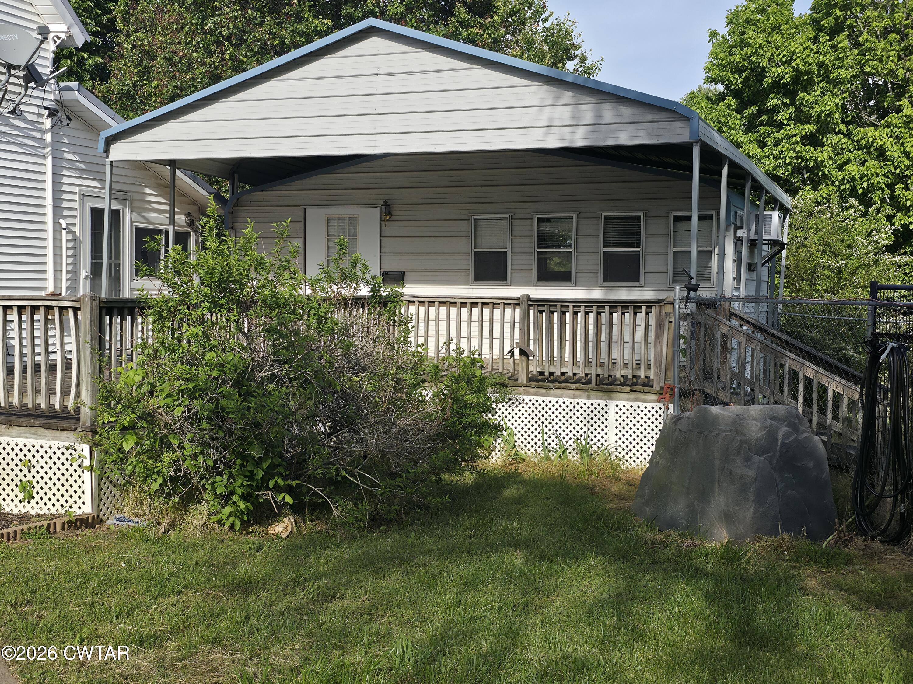111 Leighton County Line Road Denmark, TN 38391 - Photo 19 of 53 a front view of a house with a garden