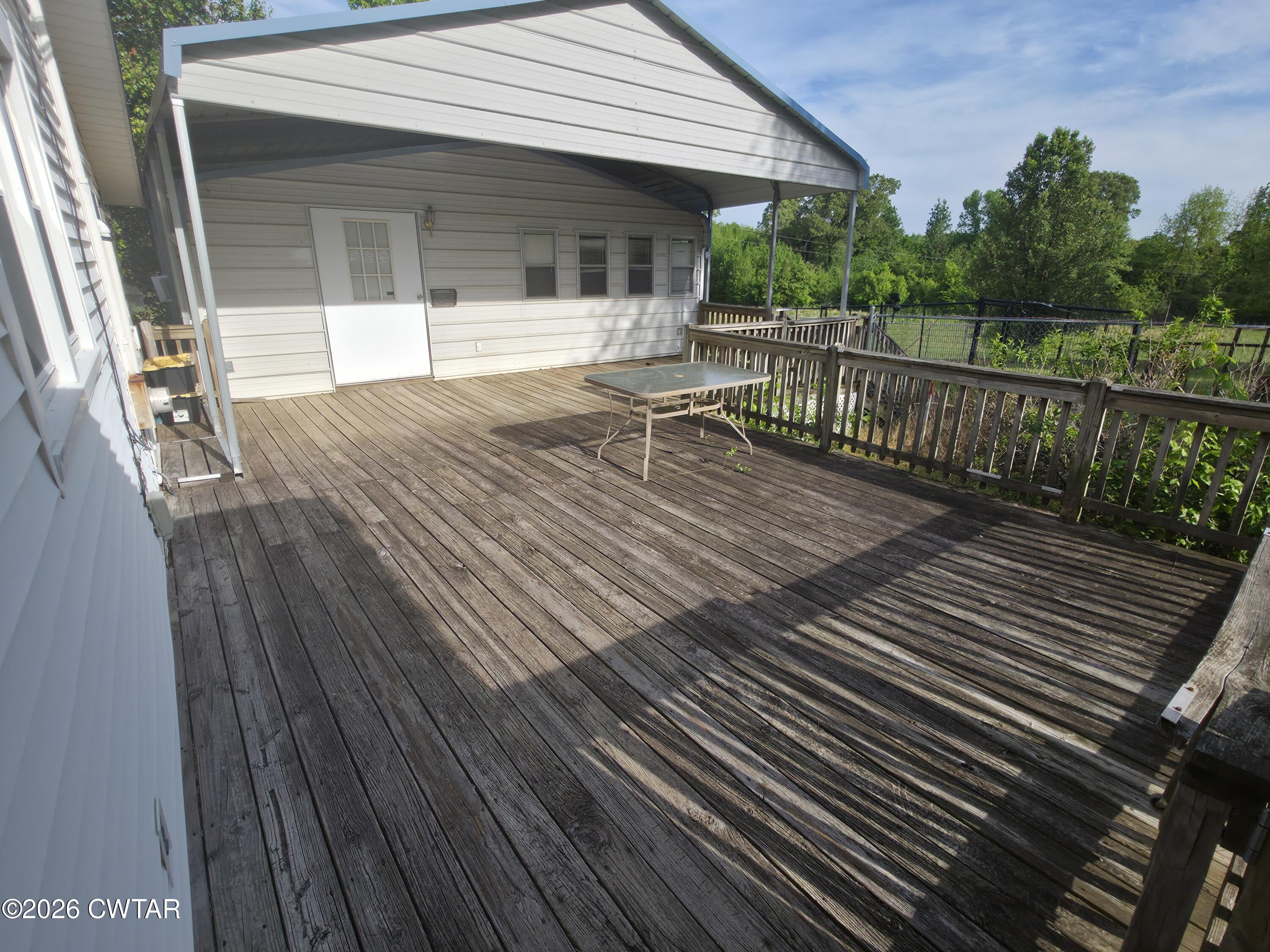 111 Leighton County Line Road Denmark, TN 38391 - Photo 20 of 53 a view of a house with wooden deck
