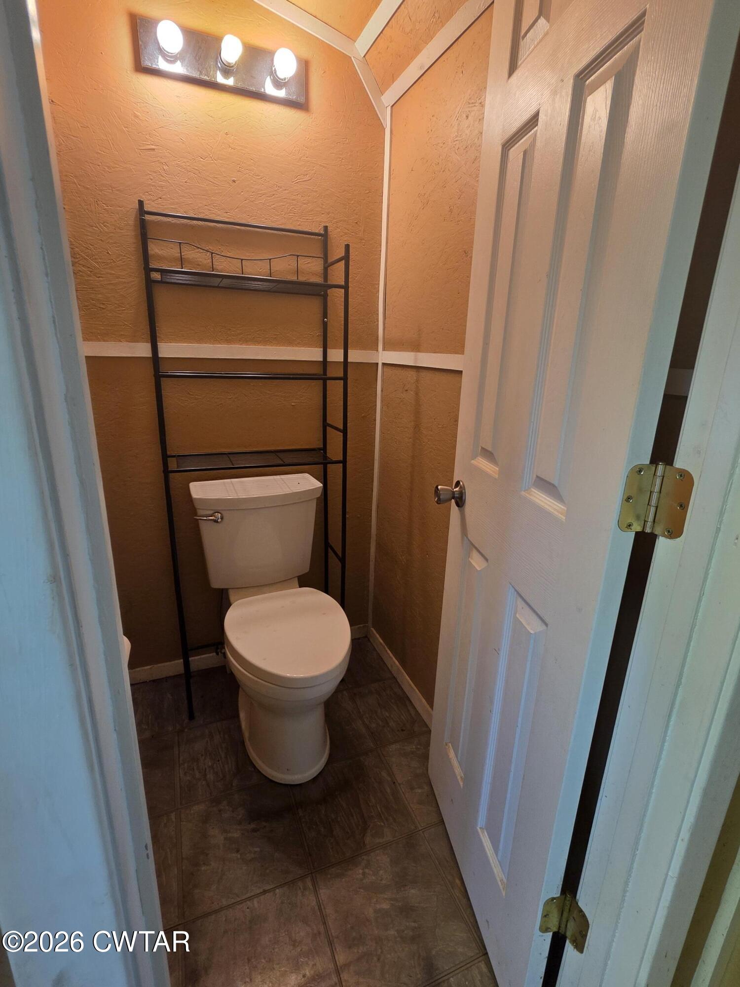 111 Leighton County Line Road Denmark, TN 38391 - Photo 23 of 53 a bathroom with a toilet and a shower