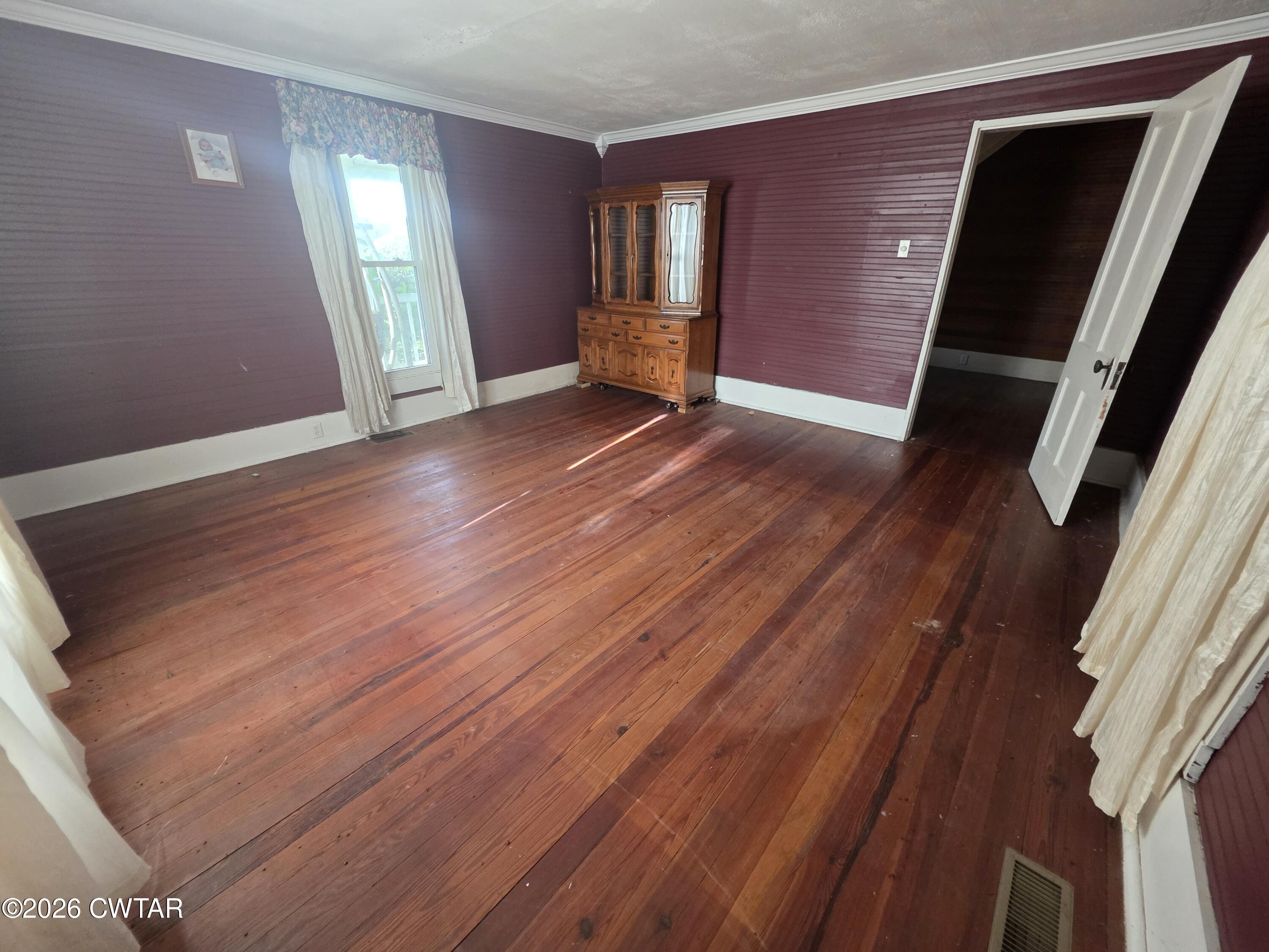 111 Leighton County Line Road Denmark, TN 38391 - Photo 30 of 53 a view of an empty room with wooden floor and a window