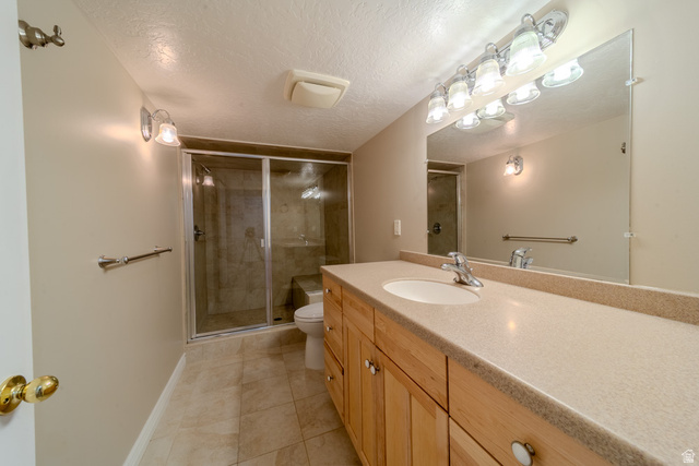 598 Hollow Creek Road Draper, UT 84020 - Photo 43 of 110 Spacious bathroom featuring a light wood-finish vanity with ample storage, a large countertop, and an integrated sink