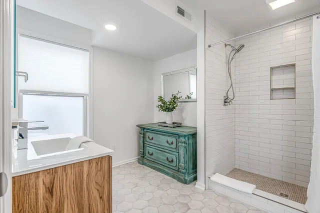 a living room with furniture and a chair