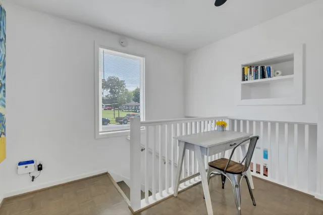 a bedroom with bed and window