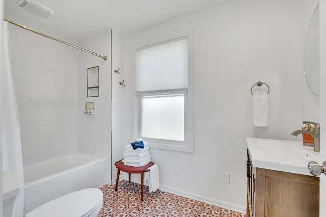 front view of a house with a large window