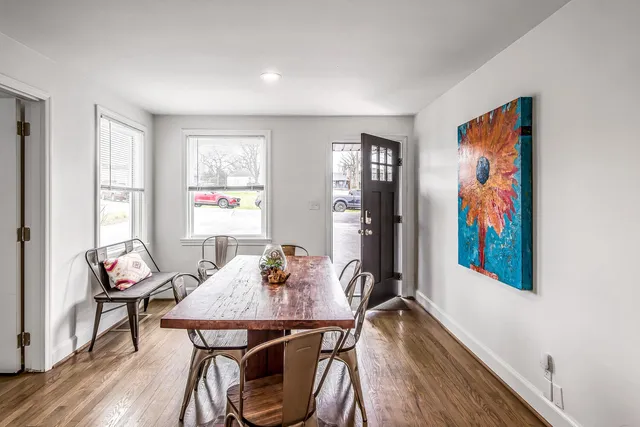 a view of a dining room with furniture window and wooden floor