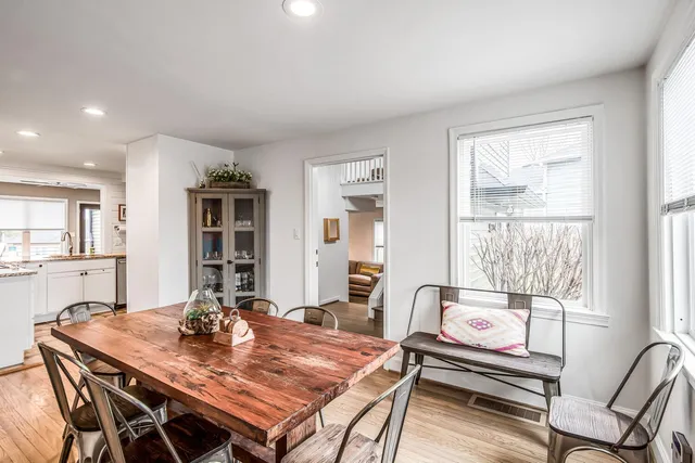 a view of a dining room with furniture and window