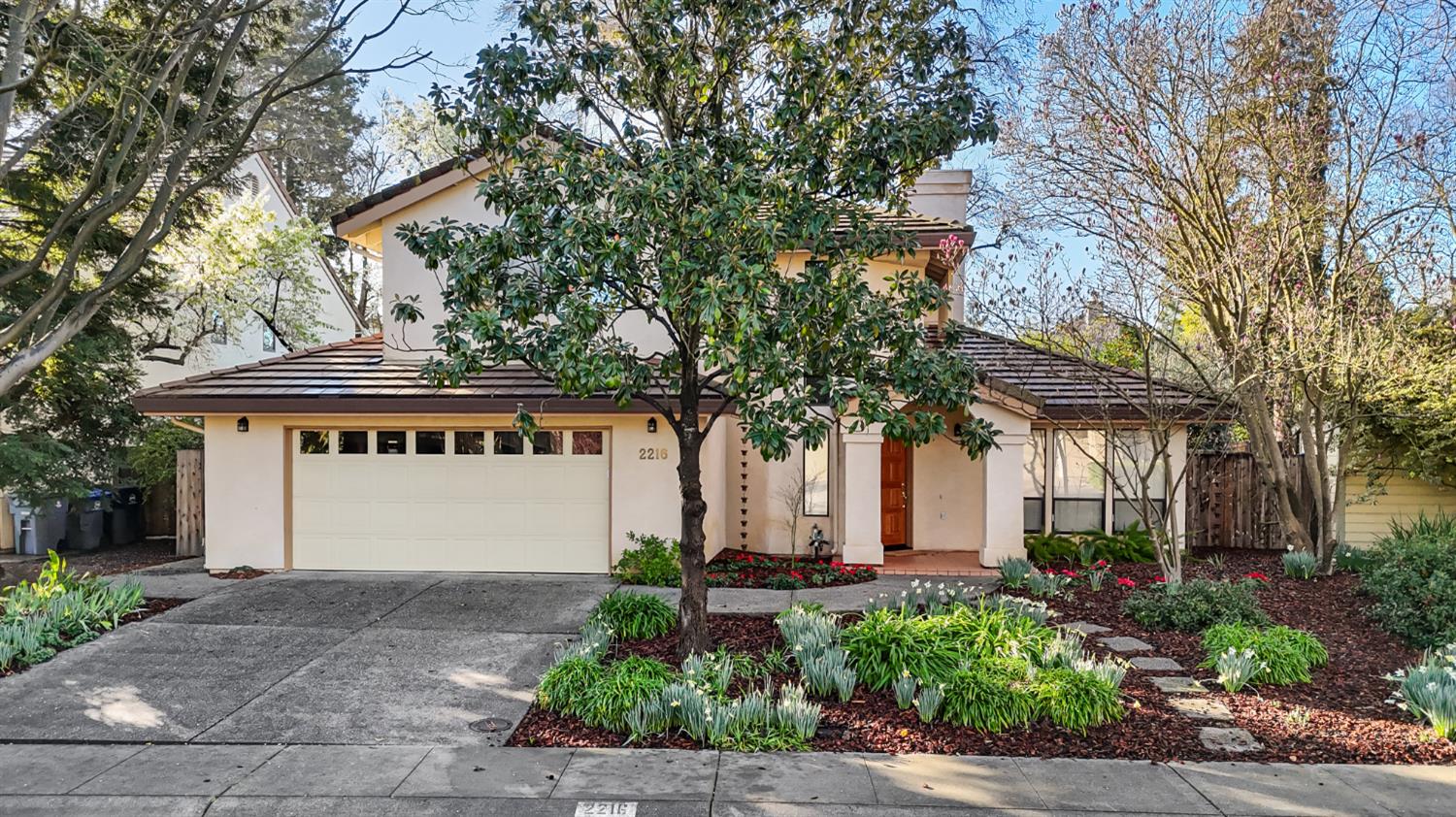 a front view of a house with garden