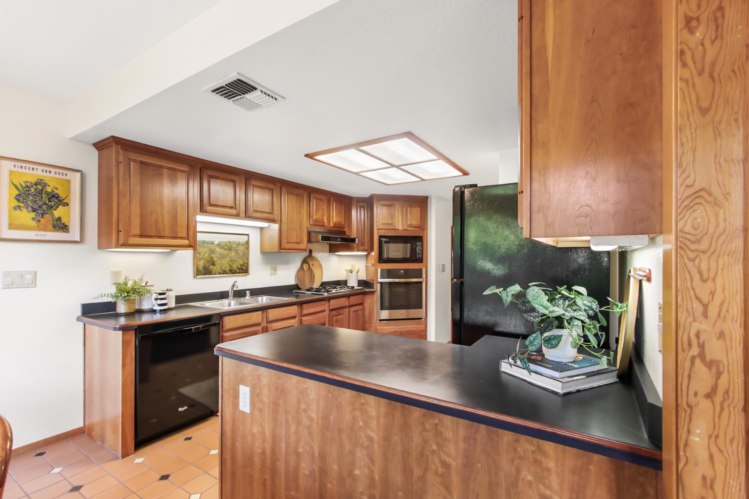 2216 Bryce Lane Davis, CA 95616 - Photo 12 of 53 a kitchen with sink refrigerator and stove