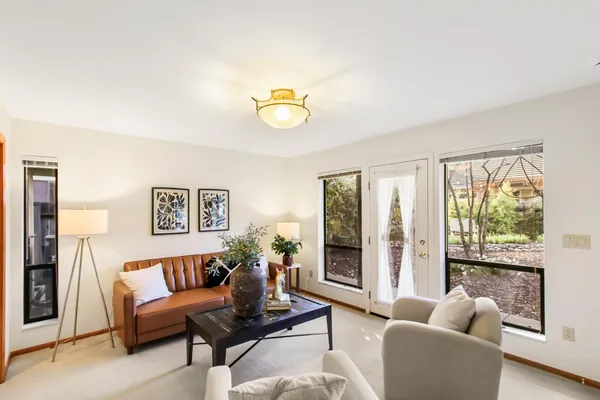 a living room with furniture and a large window