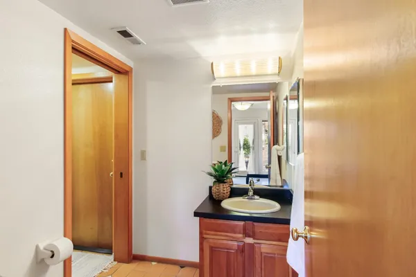a bathroom with a sink and a mirror