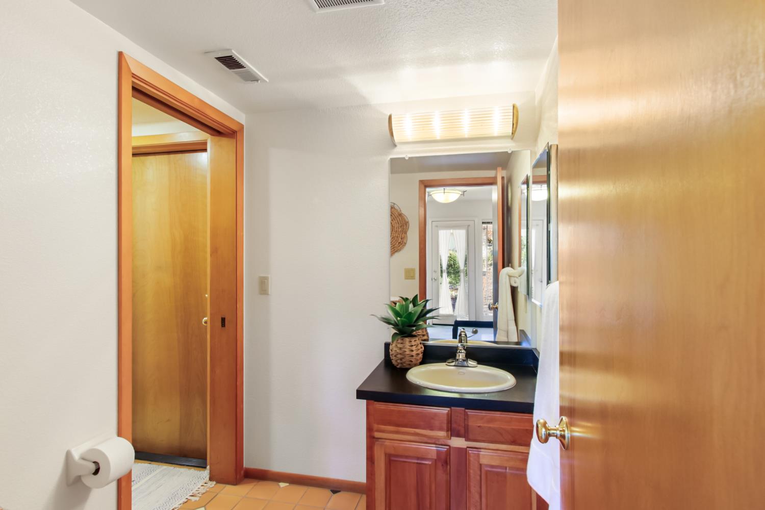 2216 Bryce Lane Davis, CA 95616 - Photo 21 of 53 a bathroom with a sink and a mirror