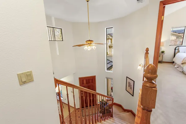 a view of a hallway with furniture and entryway