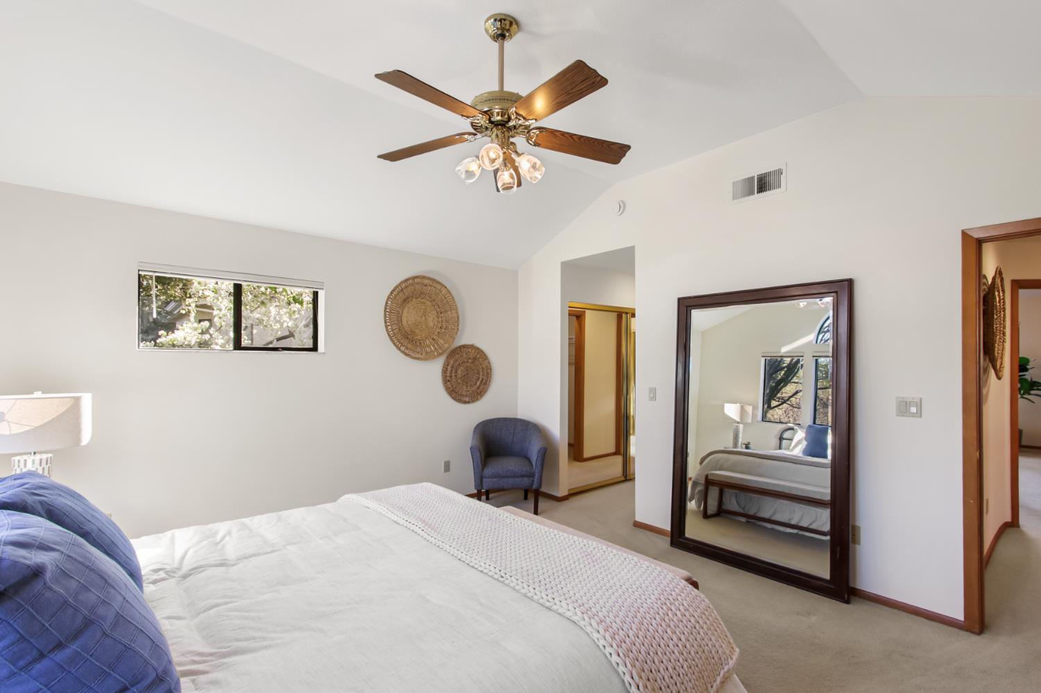 2216 Bryce Lane Davis, CA 95616 - Photo 26 of 53 a bedroom with a bed and a chandelier