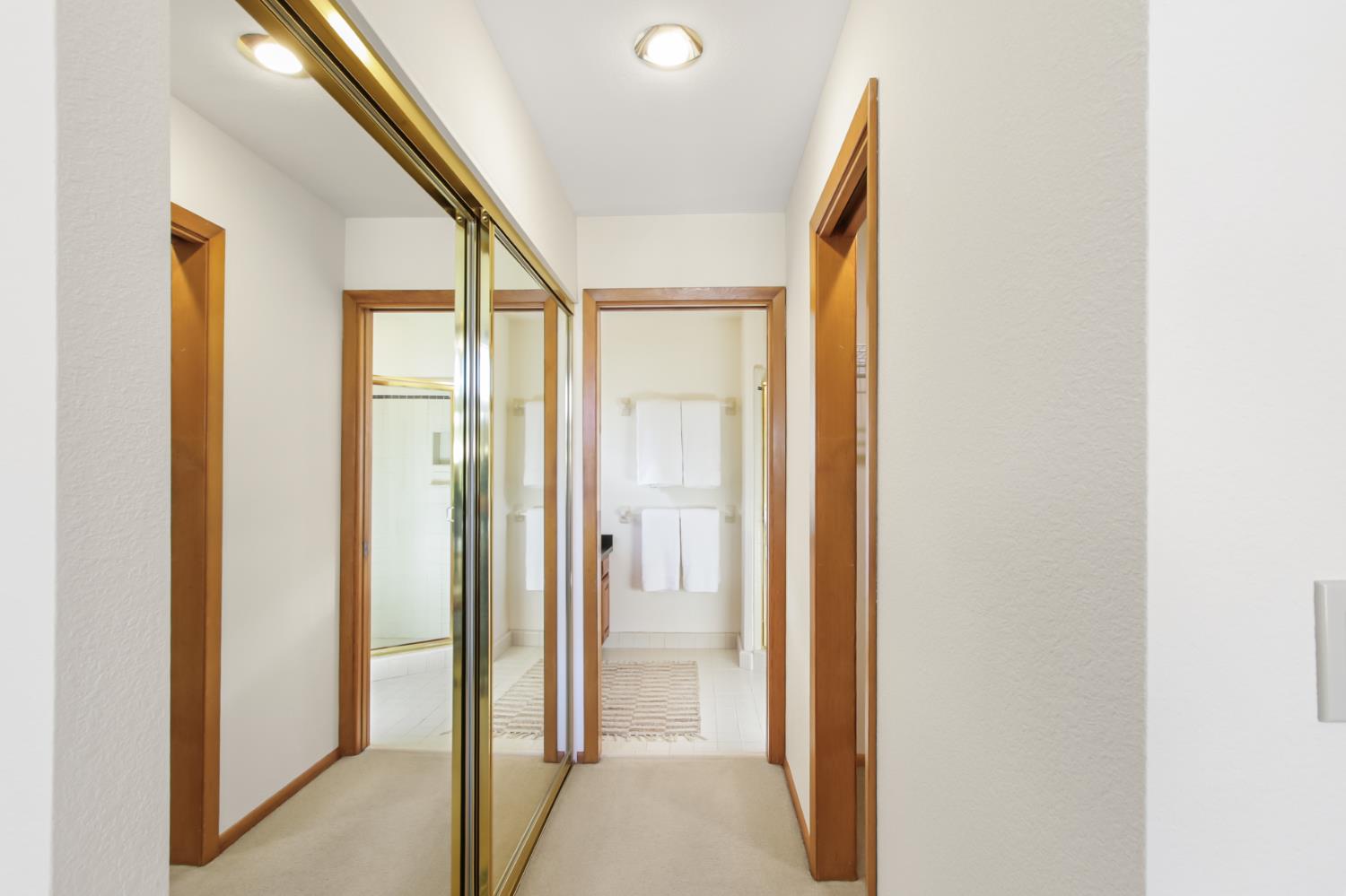 2216 Bryce Lane Davis, CA 95616 - Photo 27 of 53 a view of a hallway with wooden floor and glass doors