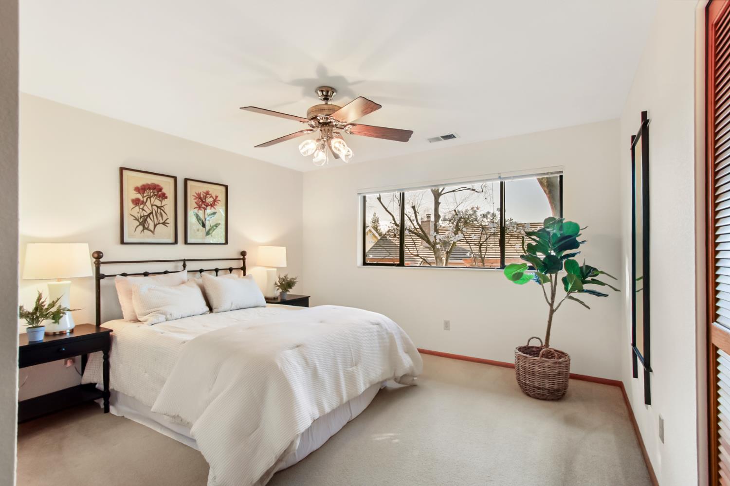 2216 Bryce Lane Davis, CA 95616 - Photo 31 of 53 a bedroom with a large bed and a potted plant