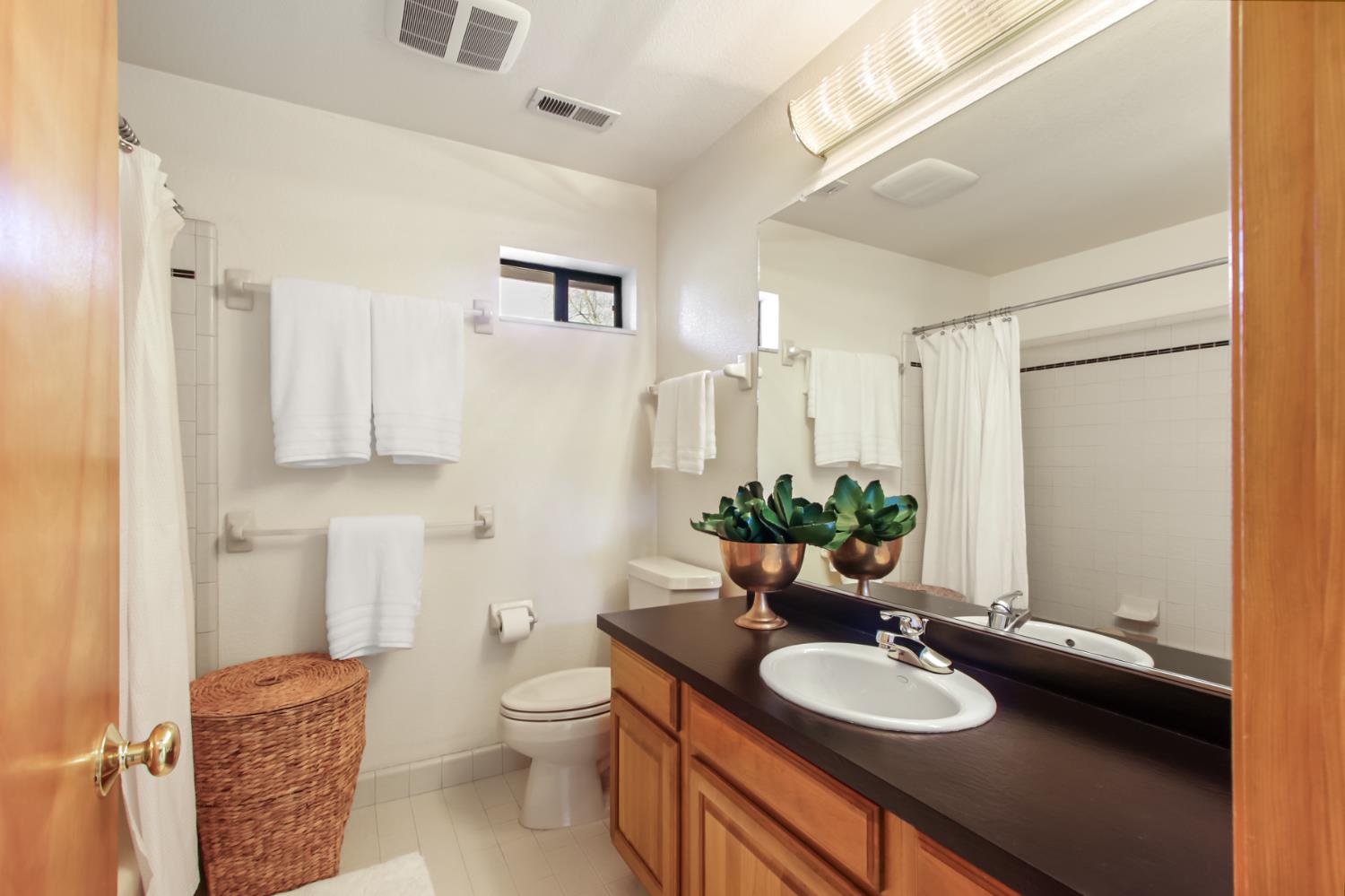2216 Bryce Lane Davis, CA 95616 - Photo 33 of 53 a bathroom with a granite countertop toilet sink and mirror