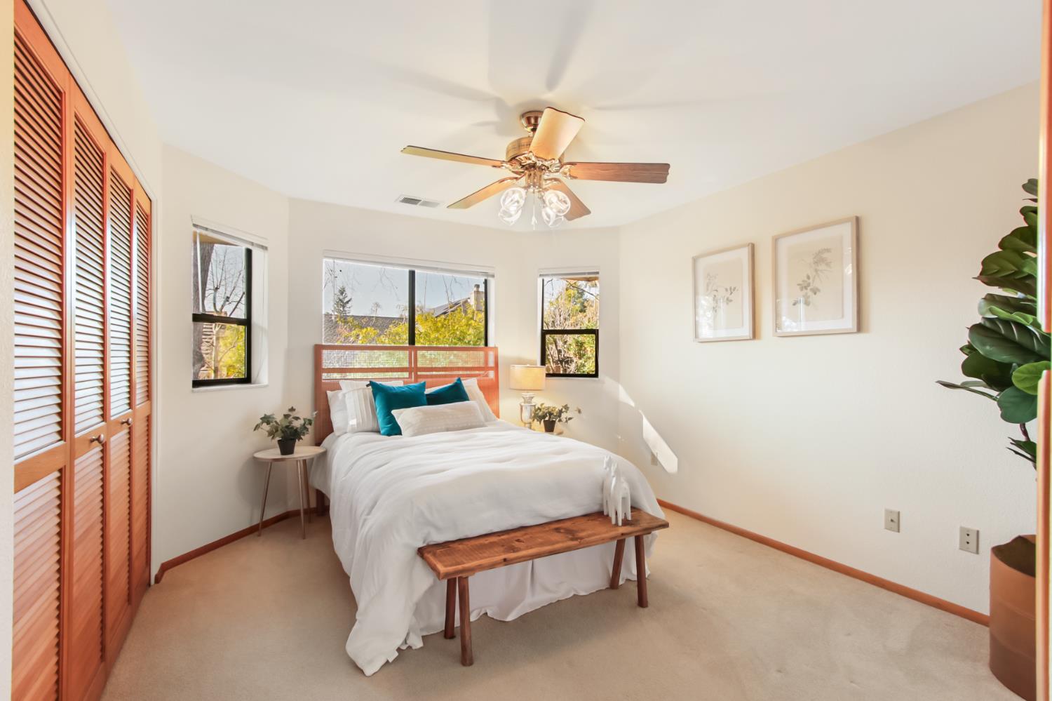 2216 Bryce Lane Davis, CA 95616 - Photo 35 of 53 a bedroom with a bed and a chandelier