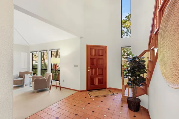 a living room with furniture and flowers