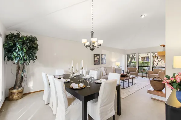 a view of a dining room with furniture window and outside view
