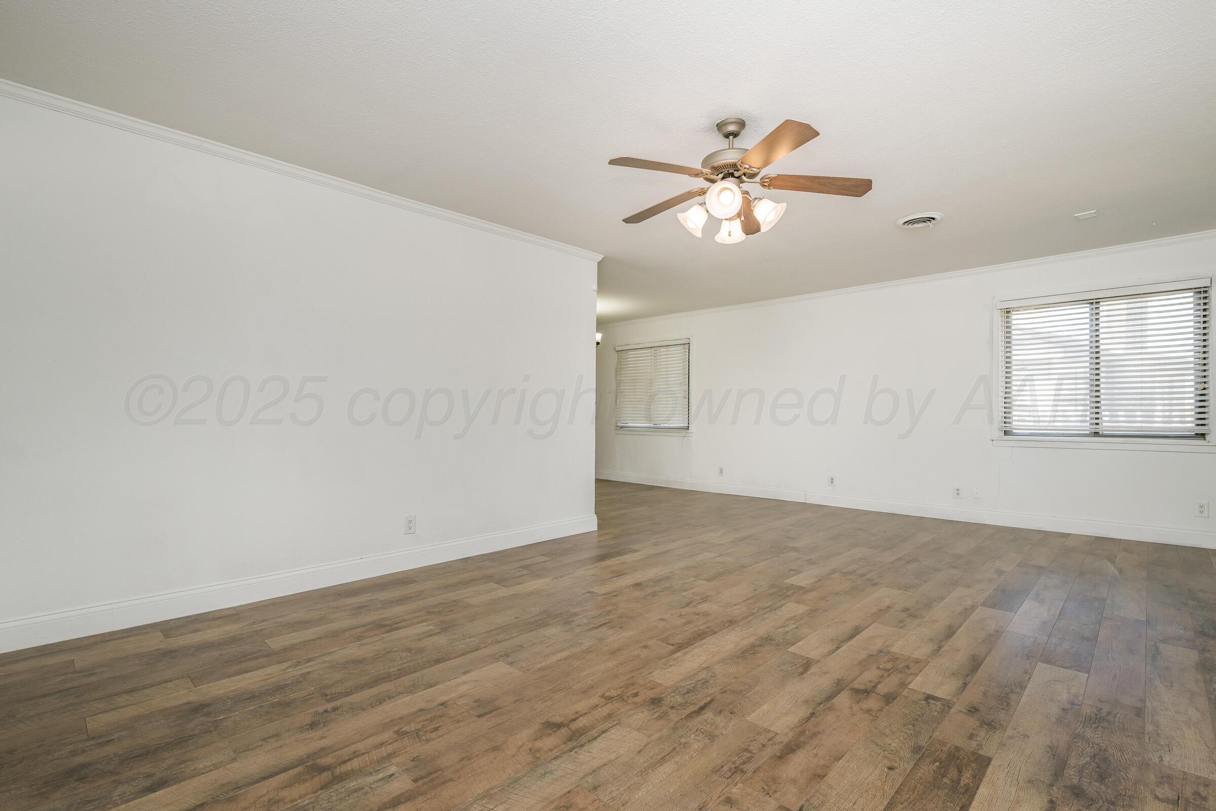 4929 Southwest 16th Avenue Amarillo, TX 79106 - Photo 6 of 19 a view of empty room with wooden floor