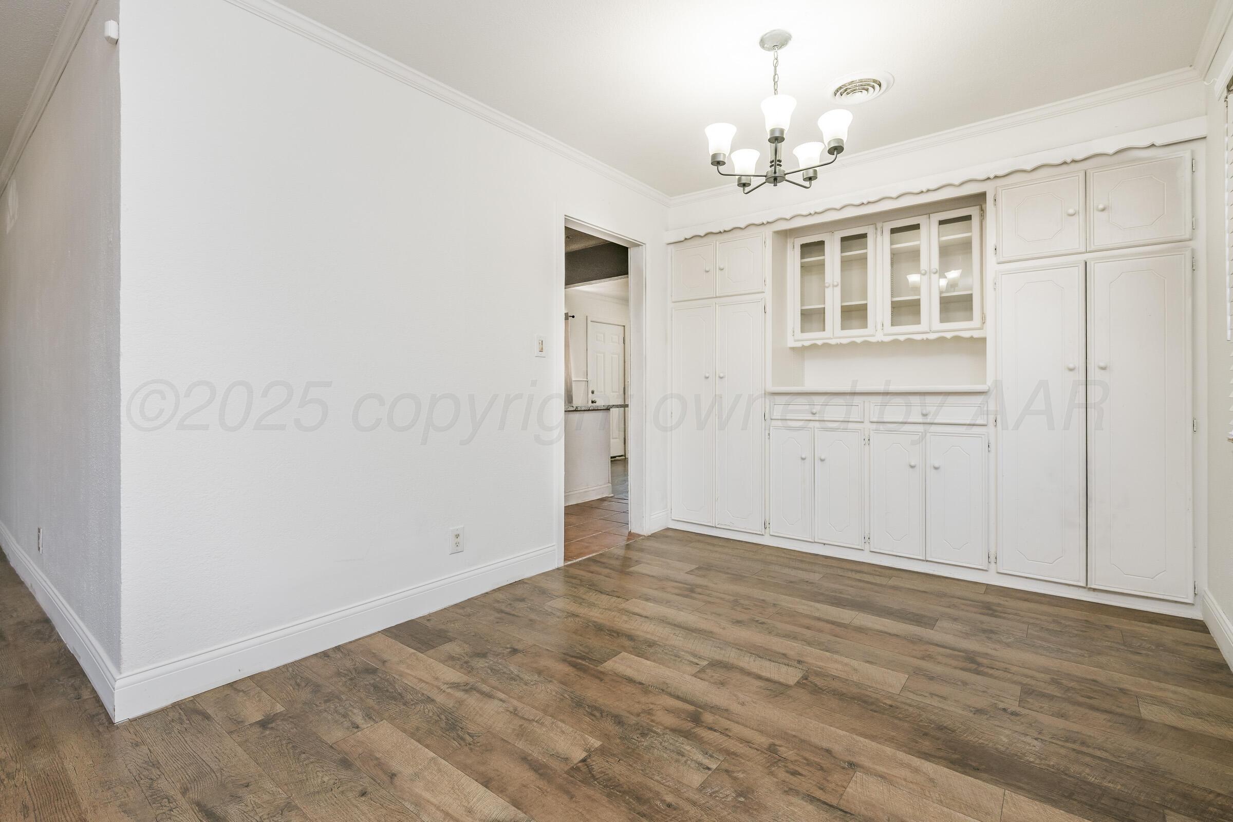 4929 Southwest 16th Avenue Amarillo, TX 79106 - Photo 8 of 19 a view of an empty room with a window