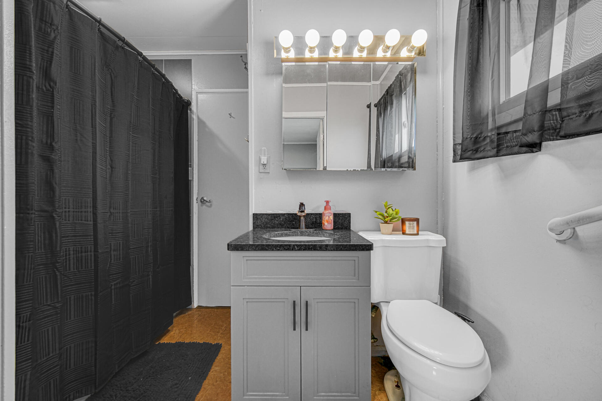 1639 174th Street Hammond, IN 46324 - Photo 15 of 21 a bathroom with a granite countertop toilet sink and mirror