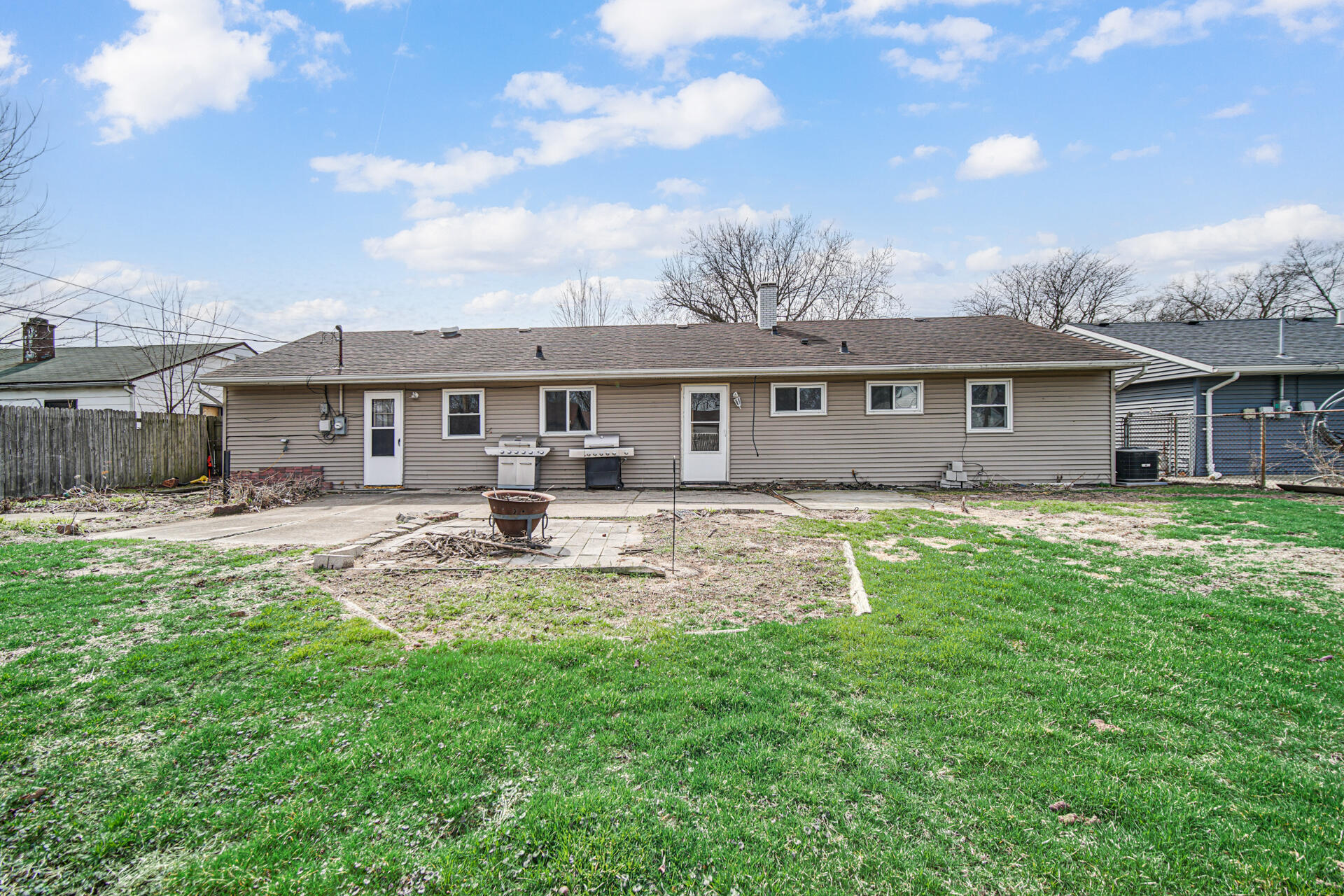 1639 174th Street Hammond, IN 46324 - Photo 20 of 21 a front view of a house with a yard table and chairs