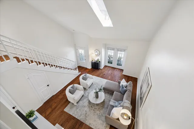 a living room with furniture and next to a window