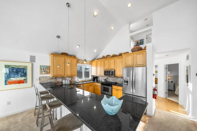 a living room with furniture fireplace and flat screen tv