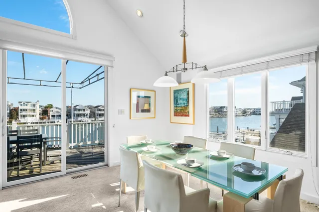 a view of a chairs and table on the deck