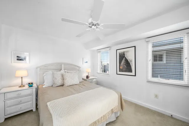a bathroom with a sink toilet vanity and shower