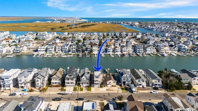 an aerial view of a city with ocean view