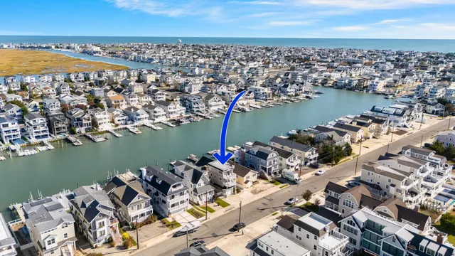 an aerial view of a city with ocean view