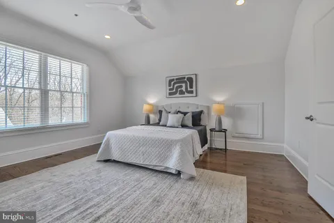 a living room with furniture a table and a flat screen tv