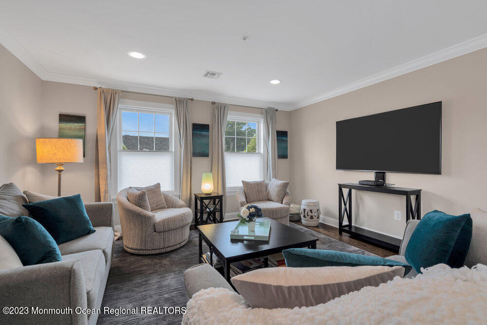 308 Morris Avenue, Unit A Spring Lake, NJ 07762 - Photo 12 of 37 a living room with furniture and a flat screen tv