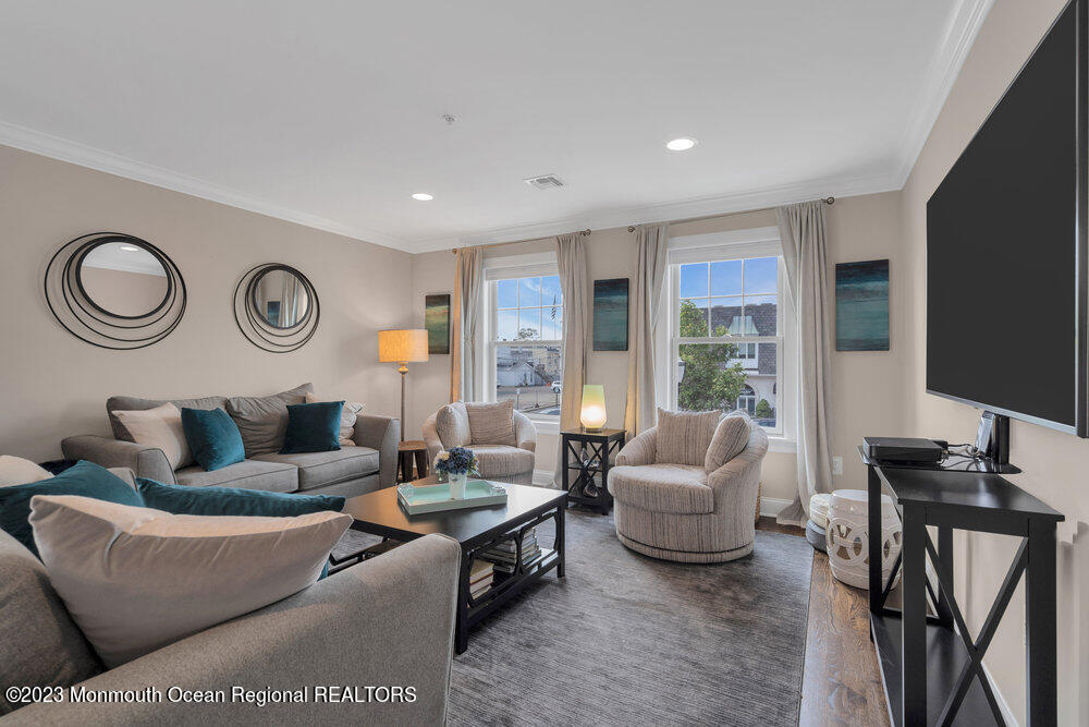 308 Morris Avenue, Unit A Spring Lake, NJ 07762 - Photo 15 of 37 a living room with furniture and a large window