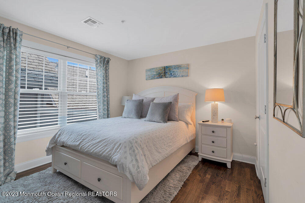 308 Morris Avenue, Unit A Spring Lake, NJ 07762 - Photo 21 of 37 a bedroom with a bed and a window