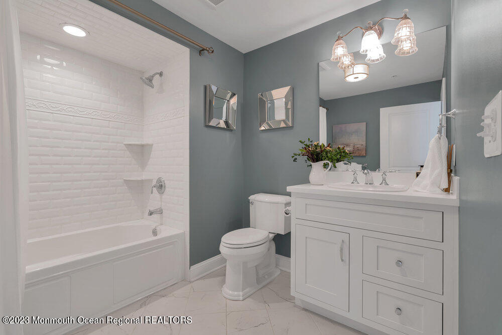 308 Morris Avenue, Unit A Spring Lake, NJ 07762 - Photo 22 of 37 a bathroom with a sink toilet and shower