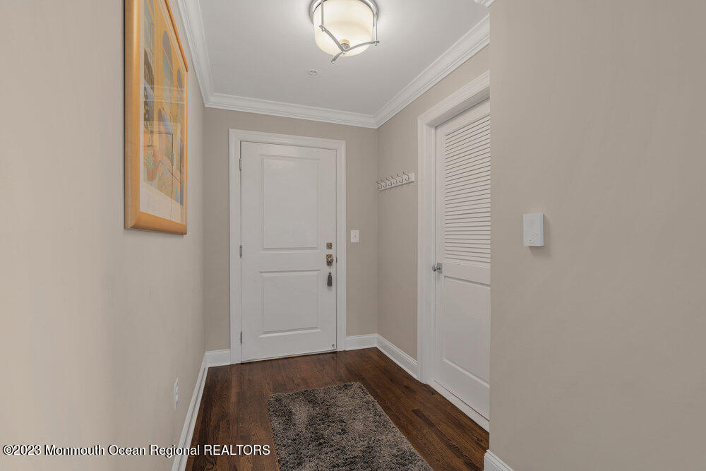 308 Morris Avenue, Unit A Spring Lake, NJ 07762 - Photo 23 of 37 a view of hallway with window and hardwood floor
