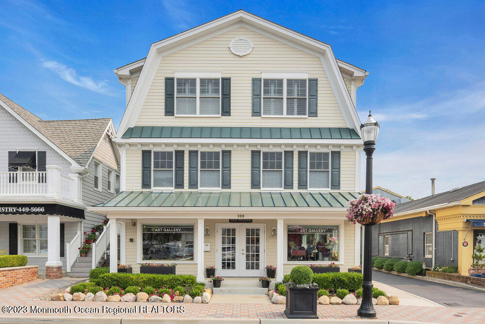 308 Morris Avenue, Unit A Spring Lake, NJ 07762 - Photo 3 of 37 a front view of a house with garden