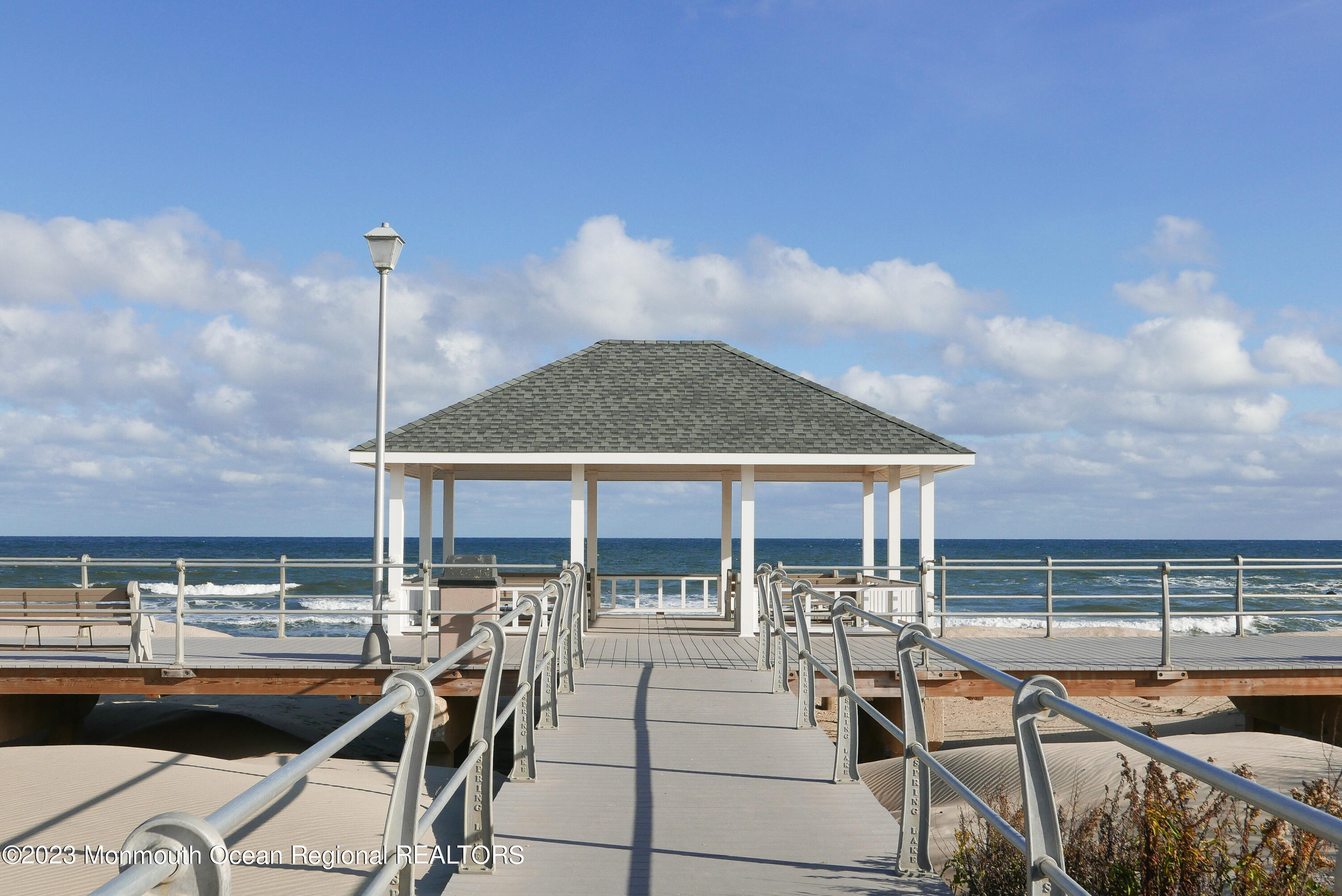 308 Morris Avenue, Unit A Spring Lake, NJ 07762 - Photo 37 of 37 a view of a patio with chairs and floor to ceiling window