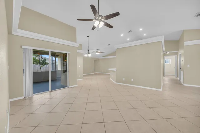 a view of an empty room and glass door