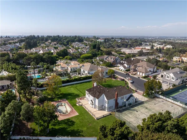 an aerial view of a house with a garden