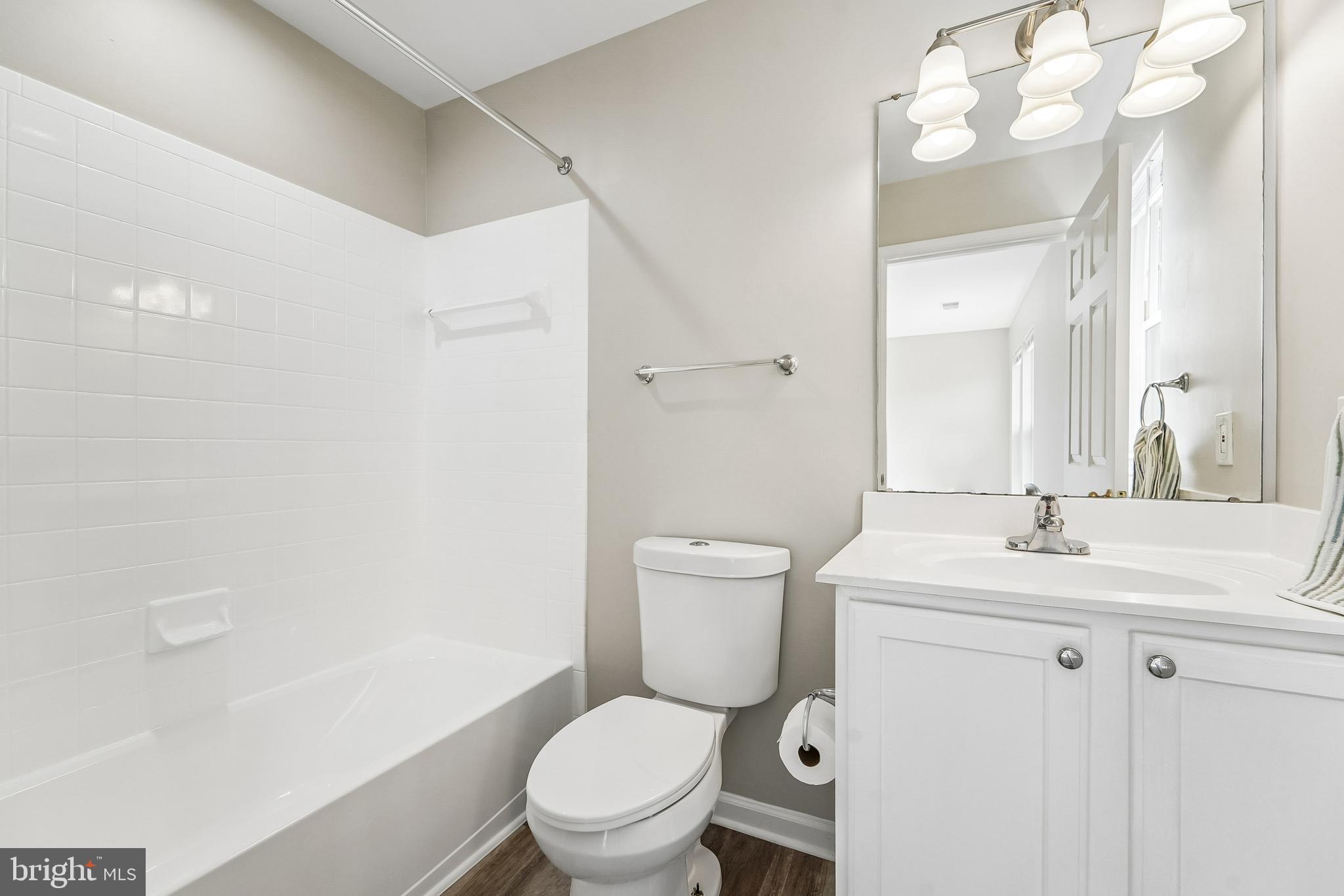 1461 Pangbourne Way Hanover, MD 21076 - Photo 25 of 51 a white toilet sitting next to a bathroom sink