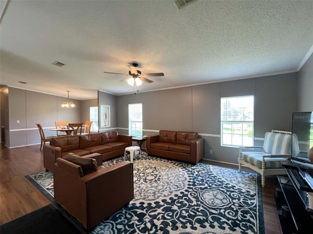 123 Amos Road Crescent City, FL 32112 - Photo 5 of 36 a living room with furniture and a window
