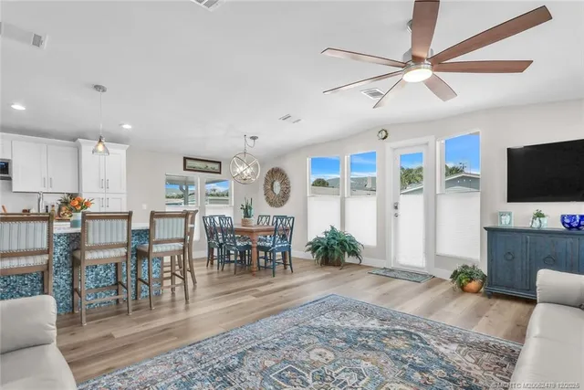 a view of a dining room with furniture window and wooden floor