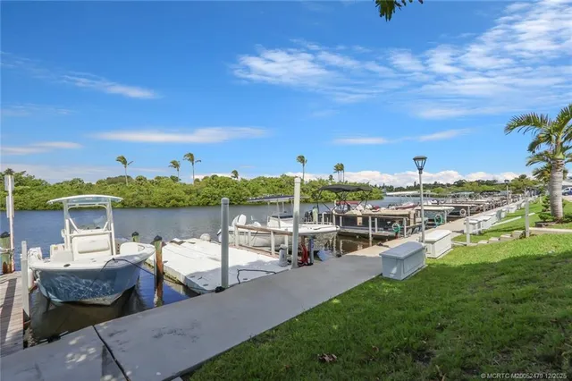 a view of a lake with couches and city view
