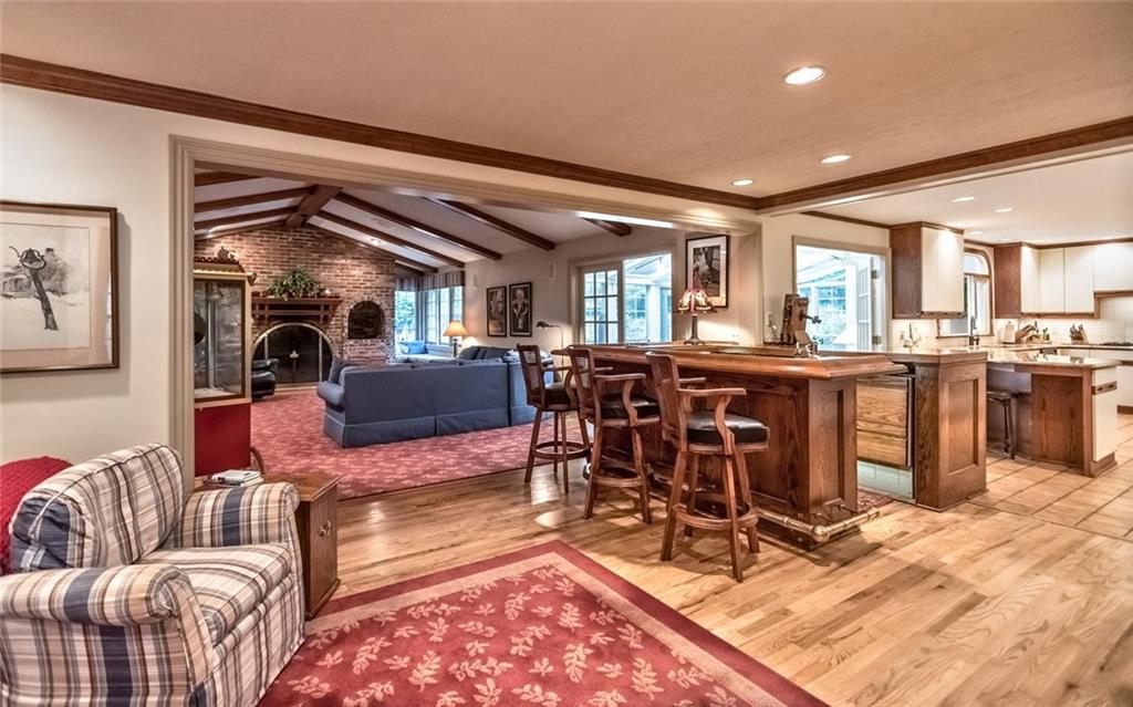 2390 Fairhill Road Sewickley, PA 15143 - Photo 12 of 25 Hearth Room Open to Kitchen & Family Room with Hardwood Floors, inviting Fireplace & Entertaining Wet Bar