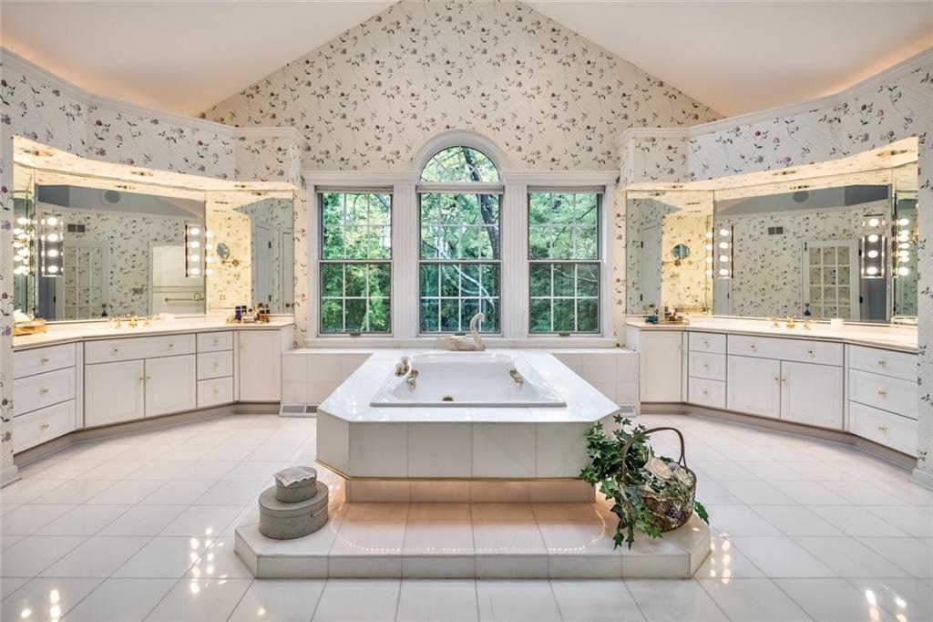 2390 Fairhill Road Sewickley, PA 15143 - Photo 21 of 25 Luxurious Private Vaulted Ceiling Master Whirlpool Bath with Skylights, Ceiling Fan, 2 Separate Vanities & Marble Glass Enclosed Shower with Body Sprays